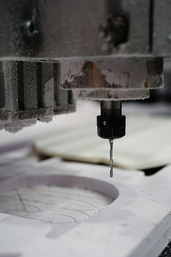 Close-up cutting wood on CNC milling  machine