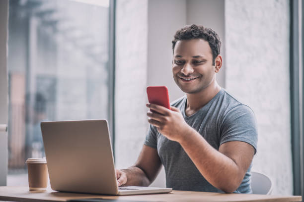 istock Young businessman sitting at the table in the office 1317638966