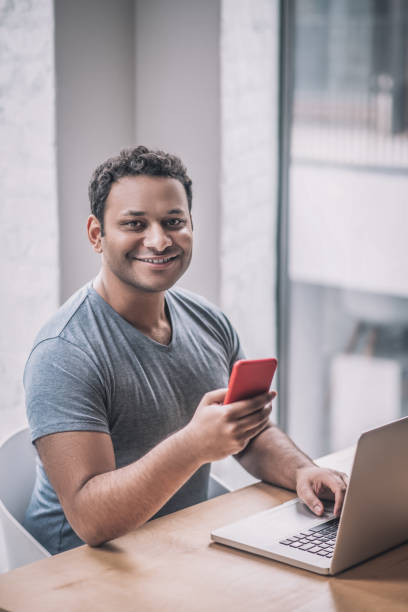 istock Young businessman sitting at the table in the office 1317638984