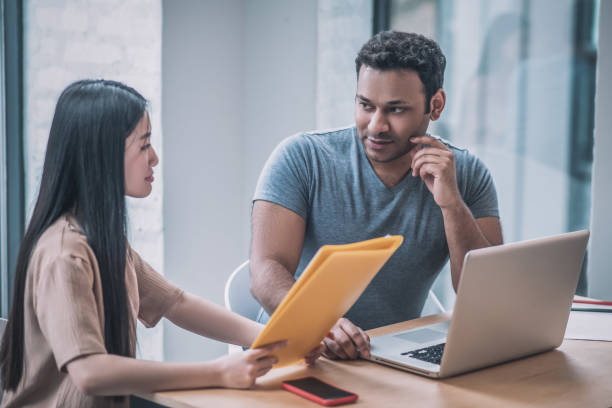 istock A chief and his assistant working in the office 1317639041