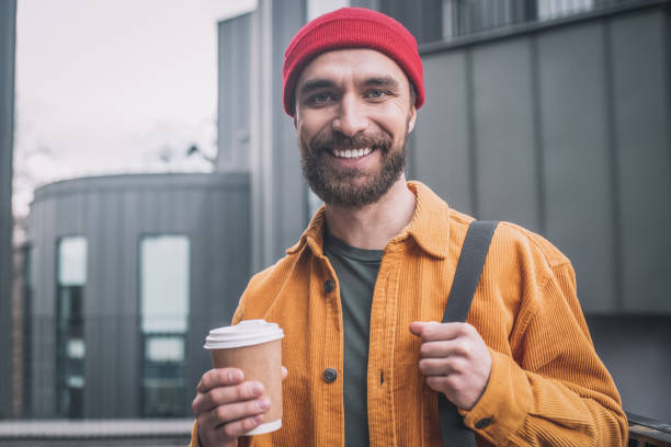 istock Young man in a red hat smiling positively 1317639190