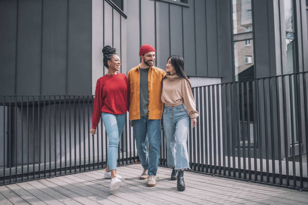 istock Three friends walking together and feeling good 1317639274