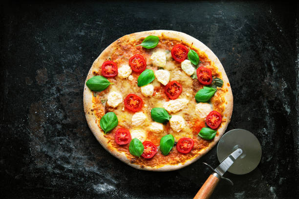 istock Crispy italian pizza with ricotta, tomatoes and basil 1317641151