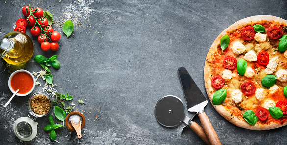 Crispy italian pizza with ricotta, tomatoes and basil. Healthy nutrition vegan lifestyle. Italian cuisine for vegetarians