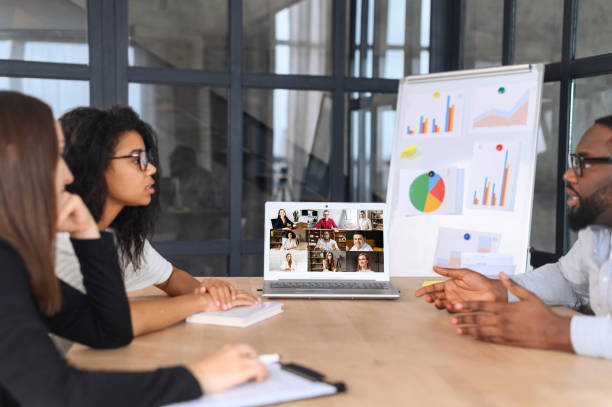 istock Multiracial team on a meeting with another colleague via video link 1317642033