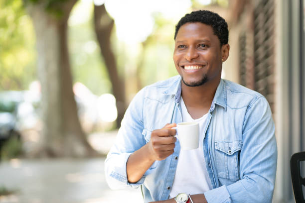 istock Man drinking coffee at coffee shop. 1317642527