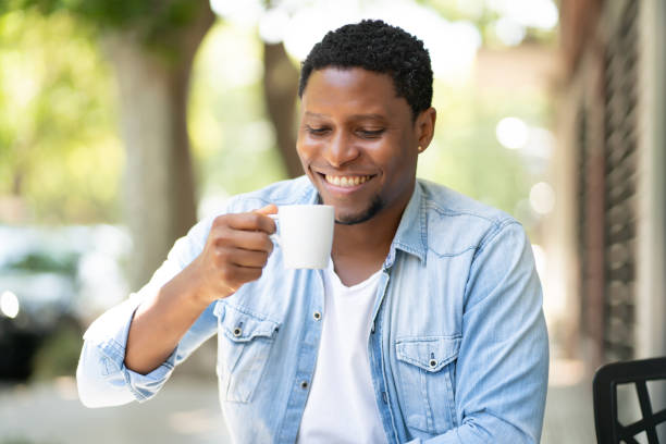 istock Man drinking coffee at coffee shop. 1317642554