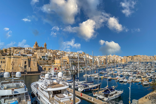 Valletta: Yachts and boats moored in the harbor of Dockyard creek in front of St Lawrence Church. The Sheer Bastion and Birgu area.