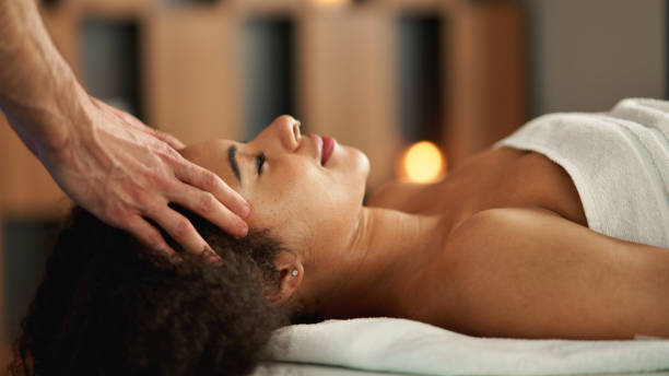 istock Young woman having head massage at the spa. 1317649110