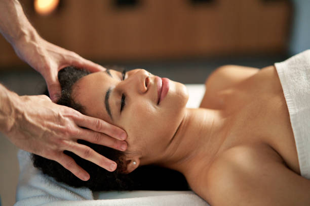 istock Young woman having head massage at the spa. 1317649904