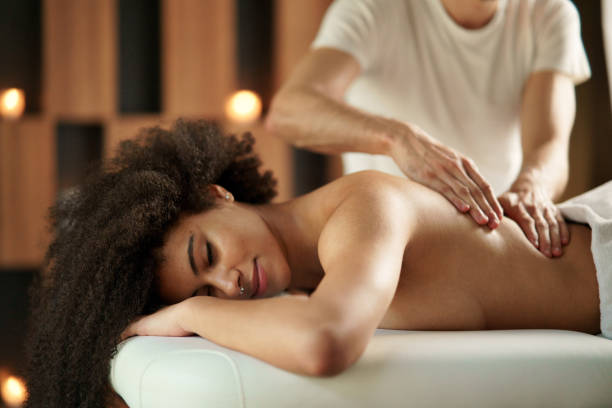 istock Young woman having back massage at the spa. 1317650439