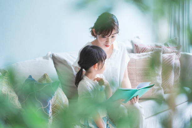 Mother and daughter reading a picture book