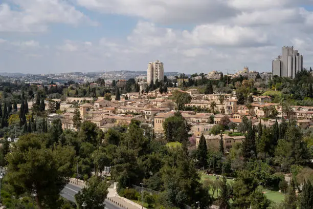Mishkenot Sha'ananim and Yemin Moshe are the first jewish neighborhoods built outside of the old Jerusalem walls. Neighborhoods of modern Jerusalem are in the background.