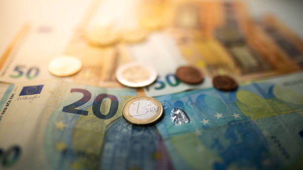 istock Euro coins and banknotes 1317654702