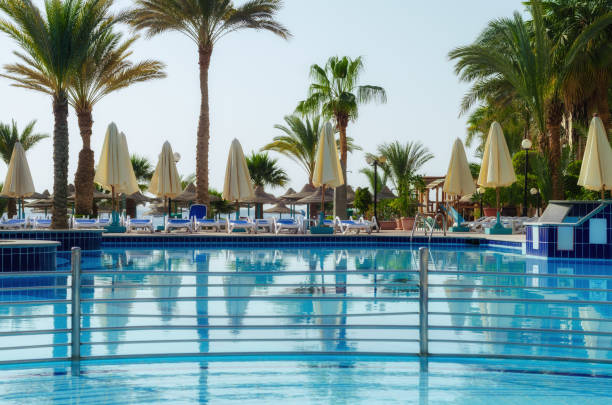 pool without people and palm trees in an empty hotel in Hurghada Egypt