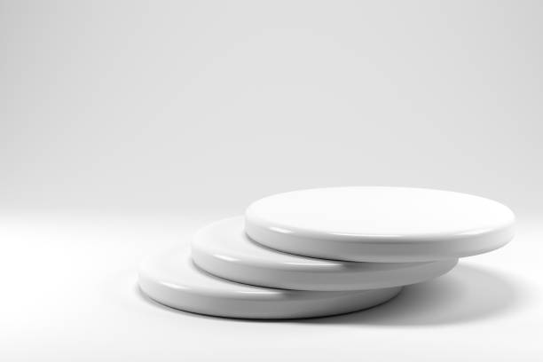 istock Shiny and glossy white round pedestal podium isolated on white background. 3D render. Abstract high quality pedestal. Podium can be add on banners, flyers, social media ads. 1317656404