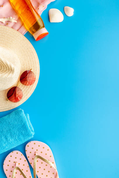 istock Layout of beach accessories with sraw hat, sunglasses and flip flops 1317656436