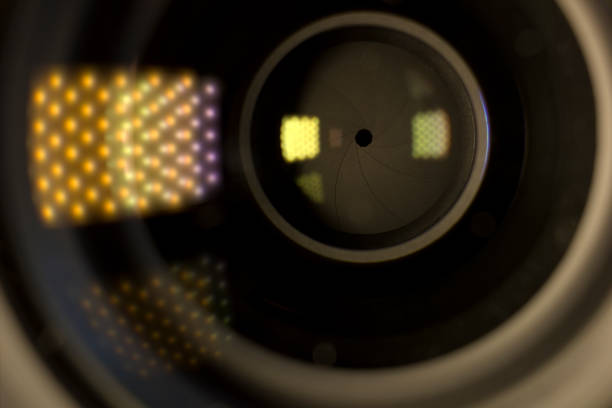 istock Camera lens with lense reflections. Open aperture objective close-up. Media and technology concept background 1317657065