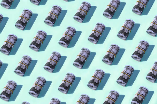 istock Dollar rolls flat lay on pastel green background 1317661123