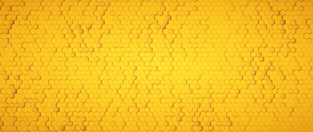 Simple yellow background made from hexagonal shapes forming a honeycomb like structure, wide horizontal composition