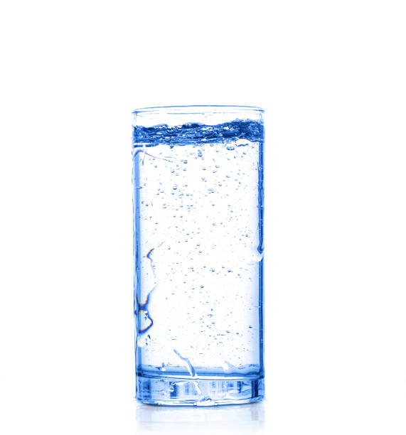 istock Glass with pouring drinking water on a white background isolate 1317663443