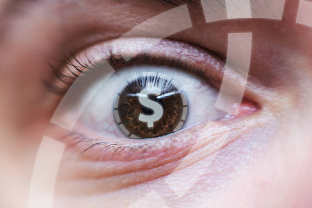 Macro shot of a human eye. Caucasian male eye close up macro. Dollar or money symbol inside.