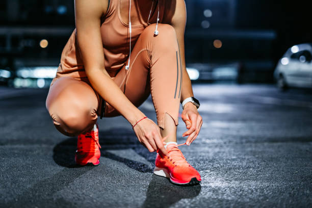 istock Tying shoelace on running shoes before practice 1317665749