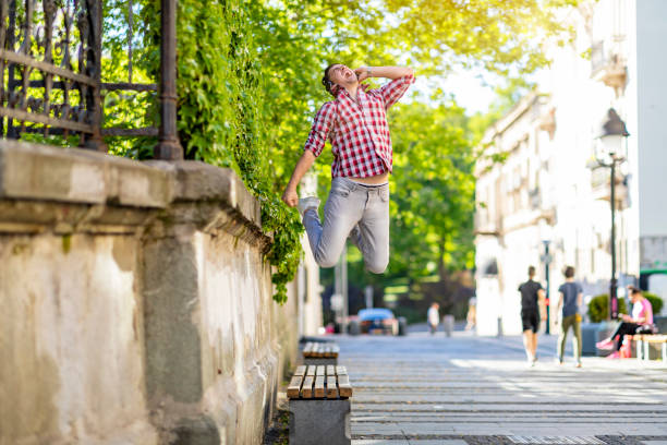 istock Modern young smiling man enjoying music outdoor 1317671830