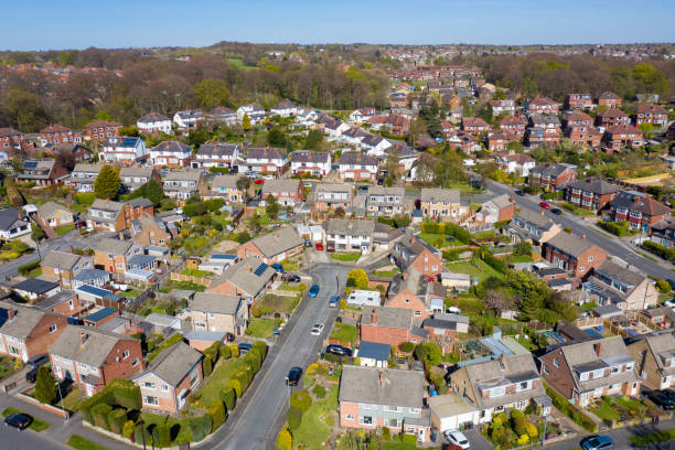 Aerial photo of the British town of Meanwood in Leeds West Yorkshire showing typical UK housing estates and rows of houses from above in the spring time on a sunny day stock photo