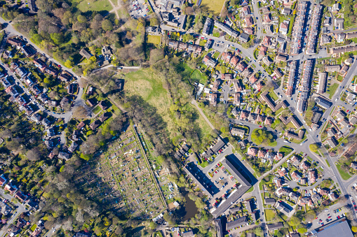 Straight down aerial photo of the British town of Meanwood in Leeds West Yorkshire showing typical UK housing estates and rows of houses in the spring time on a sunny day