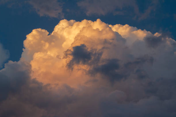 istock Cumulus clouds nimbus at sunset 1317673905