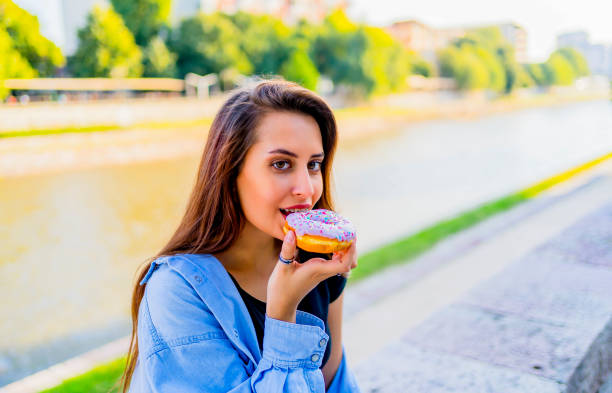 istock Eating delicious donut 1317674724