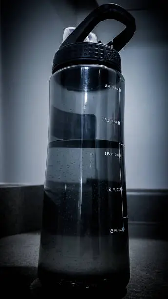 Desaturated close up water bottle