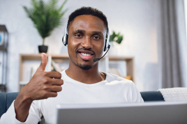 istock African man showing thumb up while working on laptop 1317676176