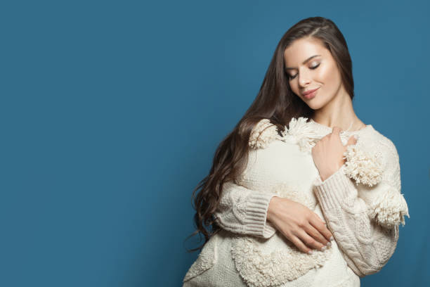 istock Resting woman with white pillow on blue banner background 1317677061