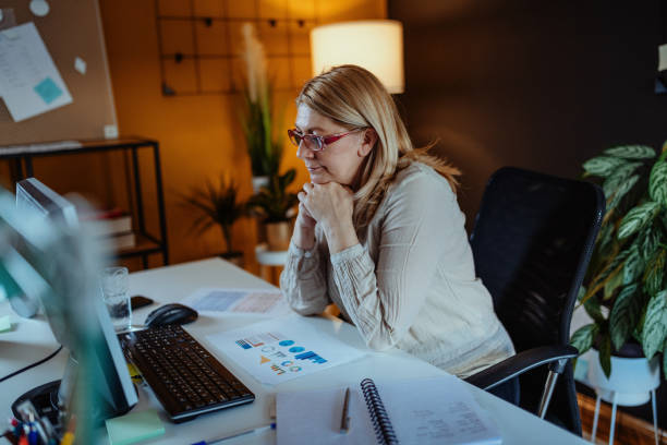 istock Mature woman doing finances at home 1317677329