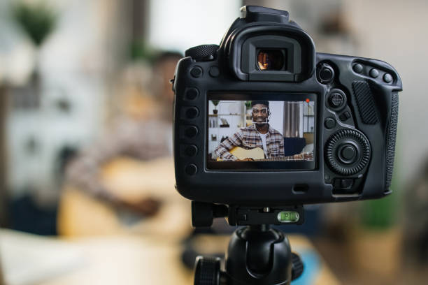 istock African guitarist teacher recording online tutorial 1317677387