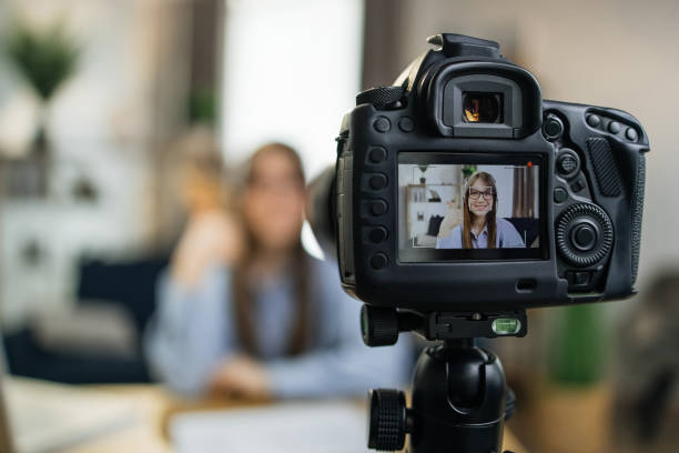 istock Female influencer using camera for leading live streaming 1317678027