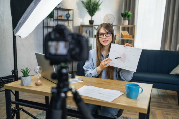 istock Business woman recording masterclass on video camera 1317678039