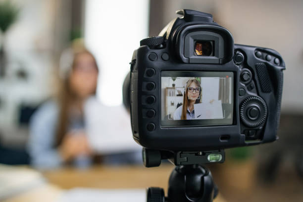 istock Smart business lady filming educational lecture on camera 1317678054