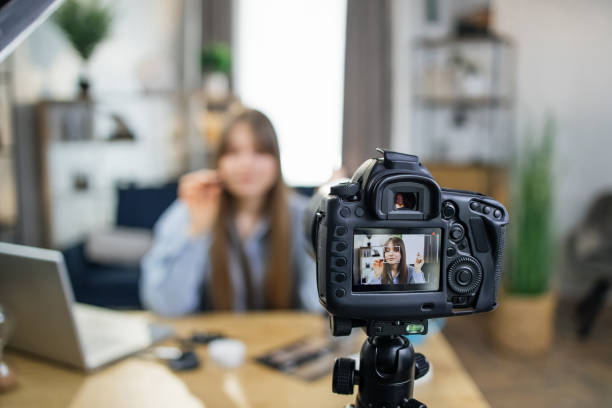 istock Popular blogger testing new cosmetics during live broadcast 1317678186