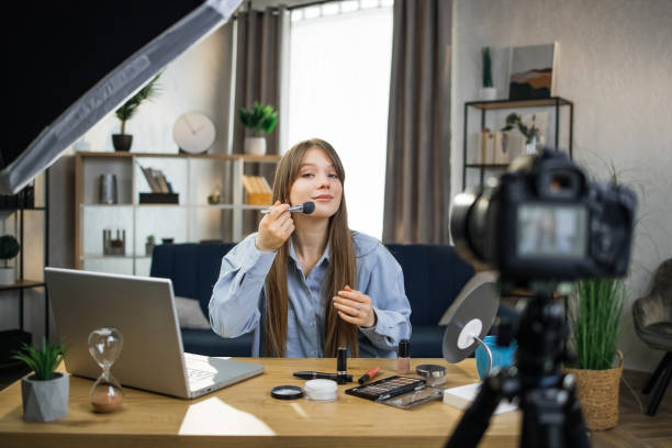 istock Female beauty blogger recording online tutorial on camera 1317678244