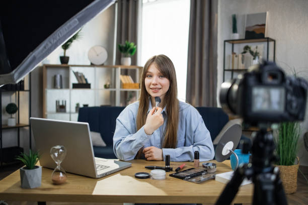 istock Female beauty blogger recording online tutorial on camera 1317678268