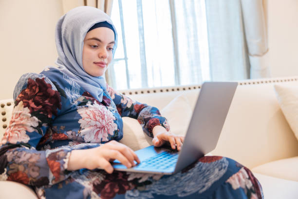 istock Middle Eastern Girl Surfing the Net using a Laptop 1317678585