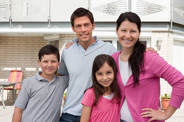 istock Beautiful young family standng together 131768105