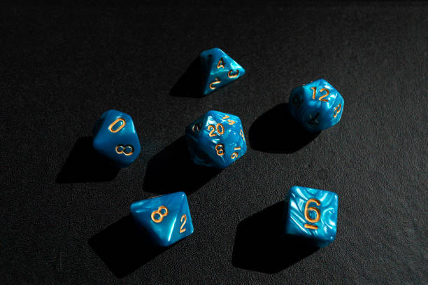 istock Set of blue role-playing game dice on a black surface 1317681197