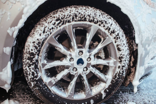 istock front wheel in soapy foam. self-service car wash concept 1317685051