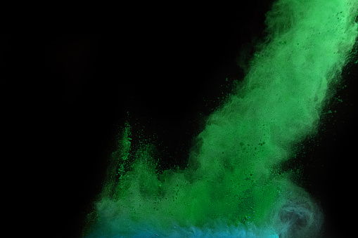 explosions with colored powder on black background