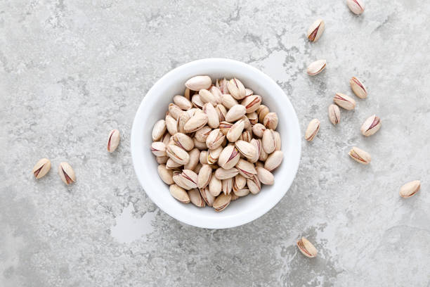 istock Pistachious in a bowl, top view 1317688403