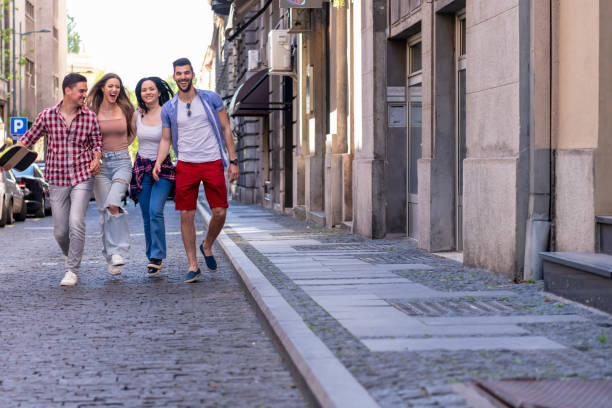 istock Group of school friends walking outdoors lifestyle 1317690083